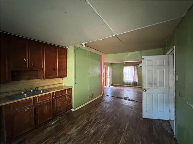 a kitchen with wooden cabinets and sink