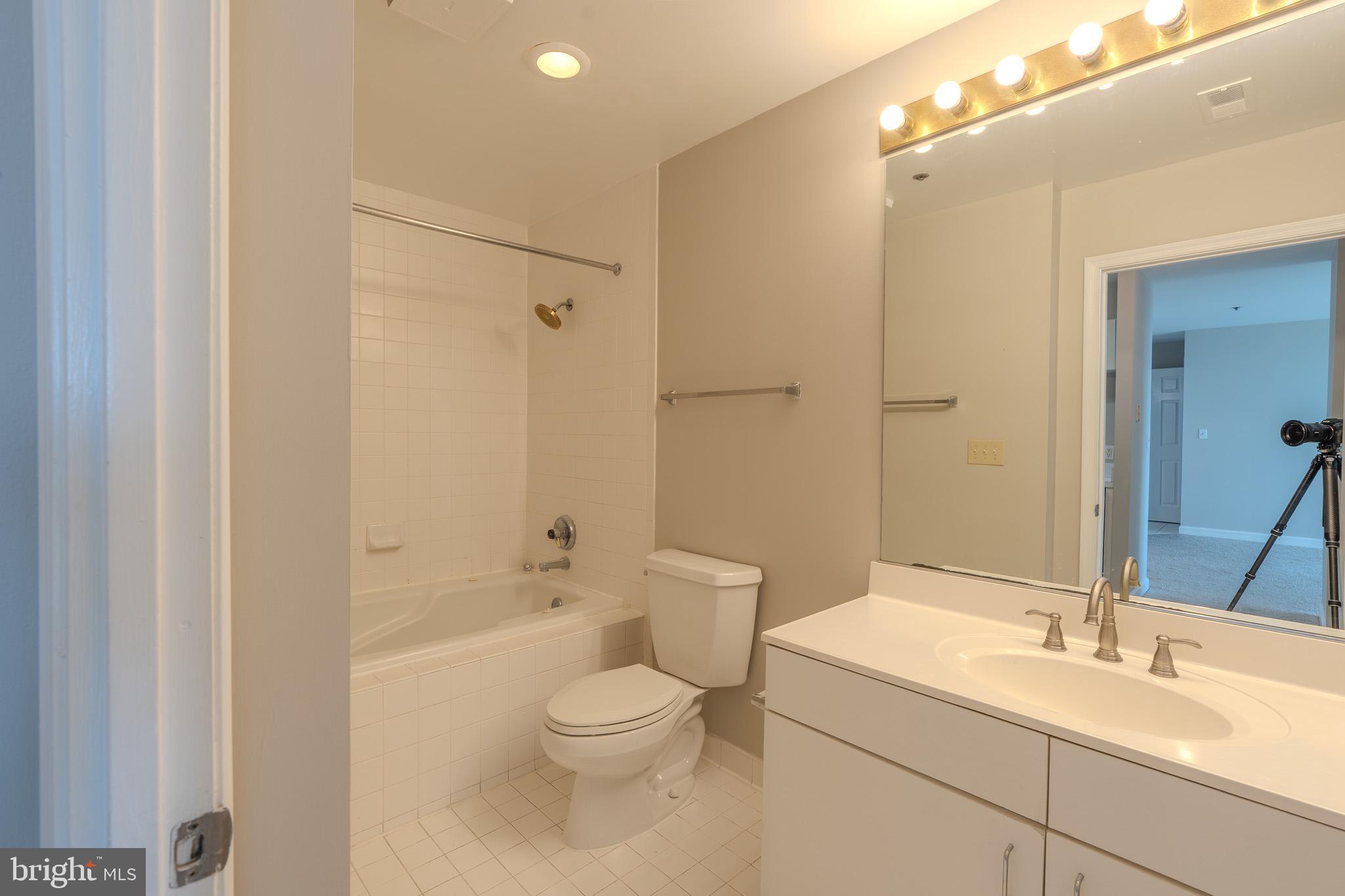 100 Harborview Drive, Unit 1208 Baltimore, MD 21230 - Photo 23 of 36 a bathroom with a sink a toilet and shower