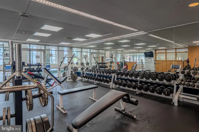 a view of gym room with gym equipment