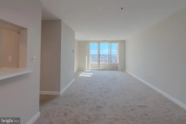 a view of a kitchen with an empty space and a fireplace