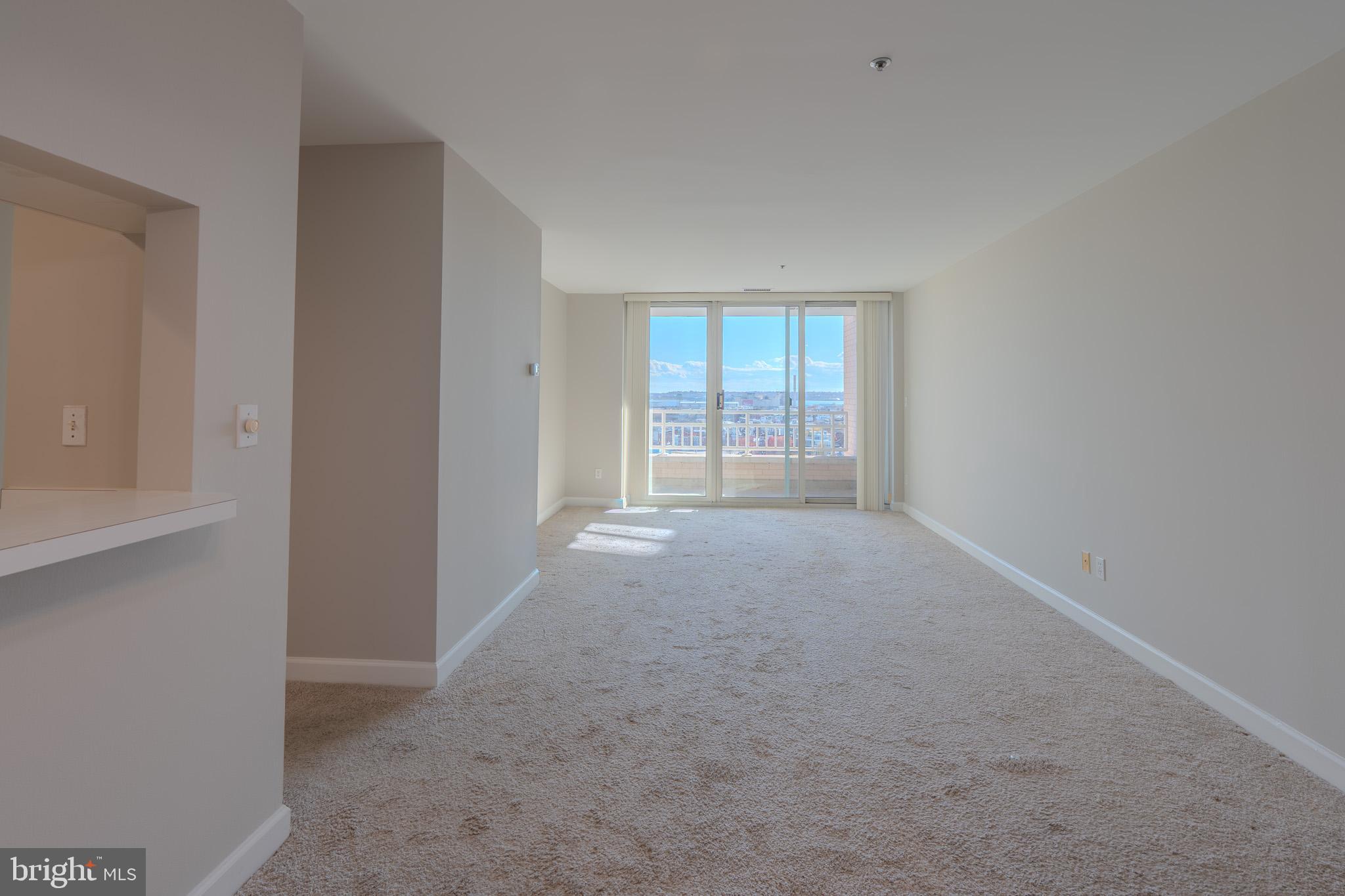 100 Harborview Drive, Unit 1208 Baltimore, MD 21230 - Photo 10 of 36 a view of an empty room with a window
