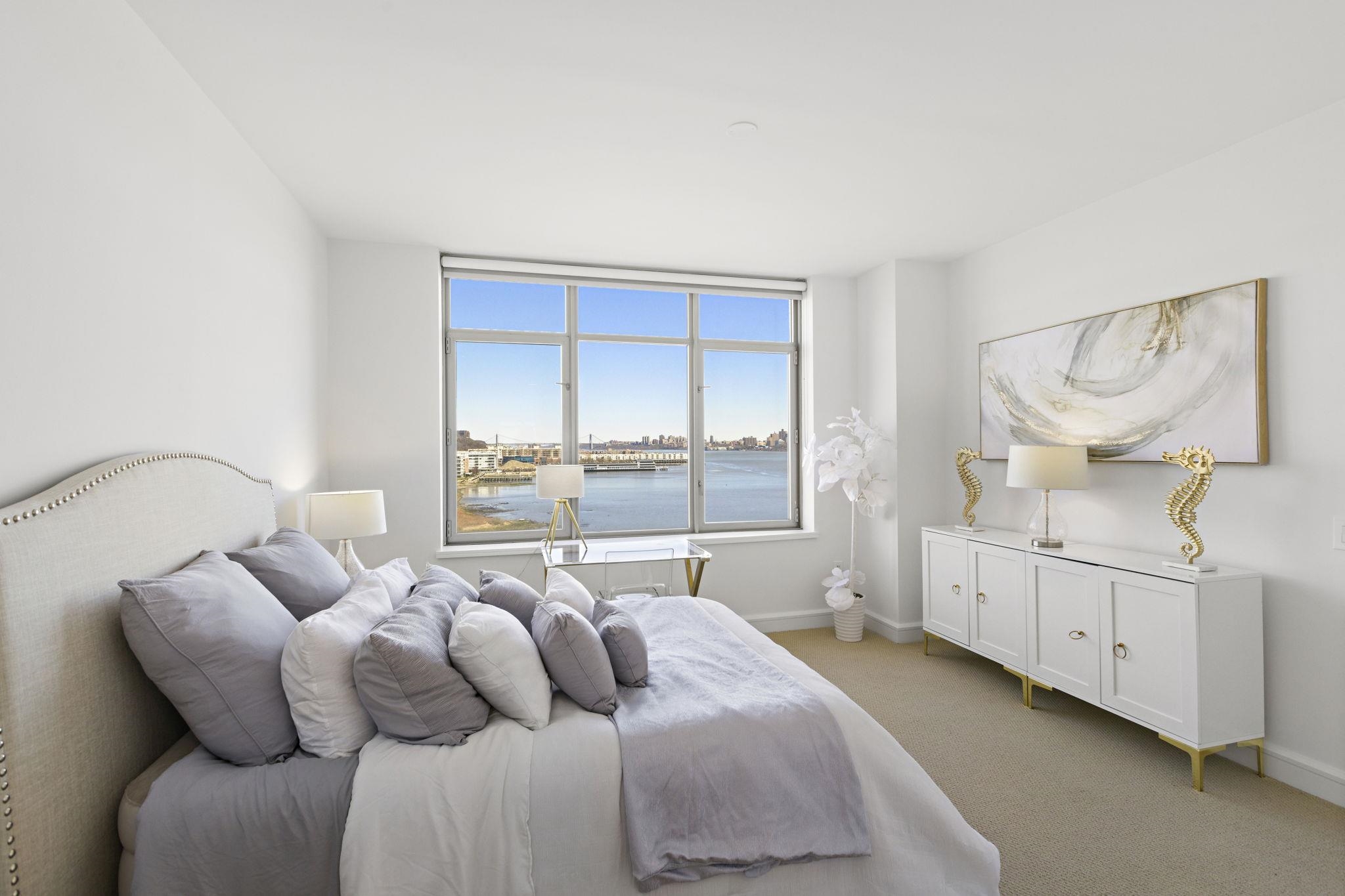 8100 River Road, Unit 1013 North Bergen, NJ 07047 - Photo 11 of 19 a bedroom with furniture and window