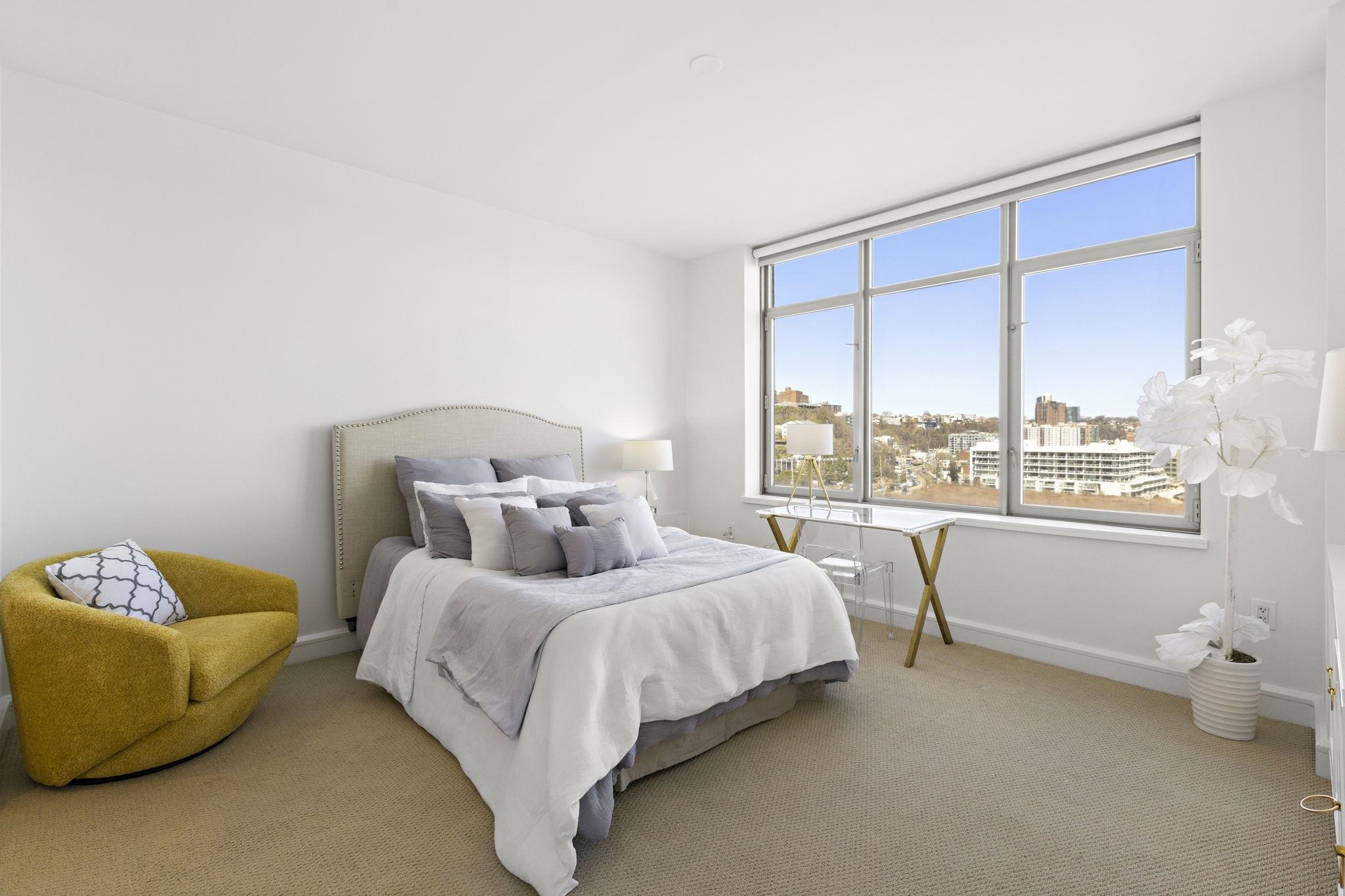 8100 River Road, Unit 1013 North Bergen, NJ 07047 - Photo 12 of 19 a bedroom with a bed and a large window