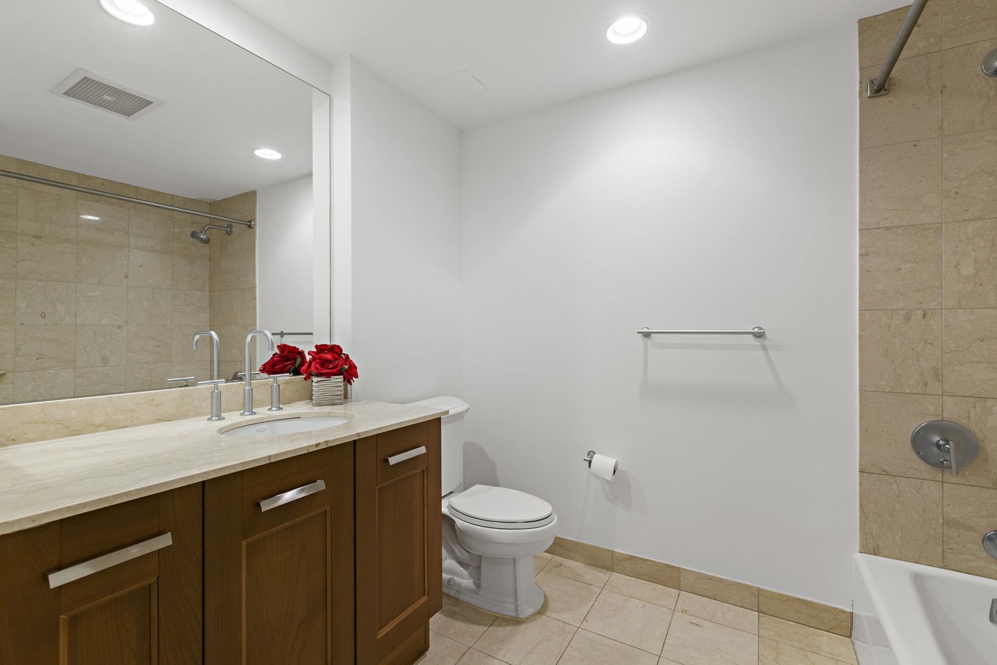 8100 River Road, Unit 1013 North Bergen, NJ 07047 - Photo 17 of 19 a bathroom with a sink toilet vanity and shower