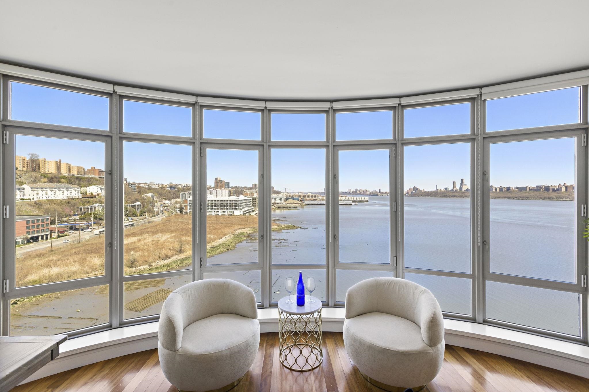 8100 River Road, Unit 1013 North Bergen, NJ 07047 - Photo 3 of 19 a living room with furniture and a large window