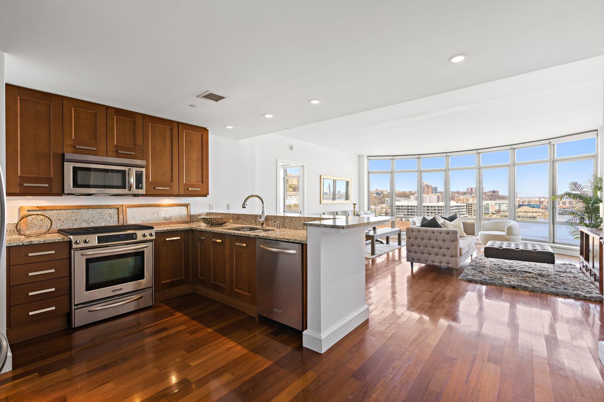 8100 River Road, Unit 1013 North Bergen, NJ 07047 - Photo 5 of 19 a kitchen with sink stove and cabinets