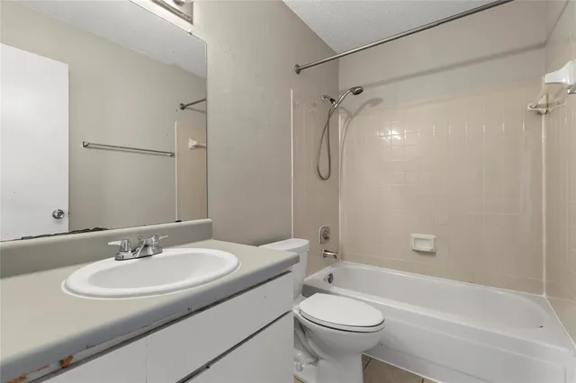 a bathroom with a sink toilet and a bathtub