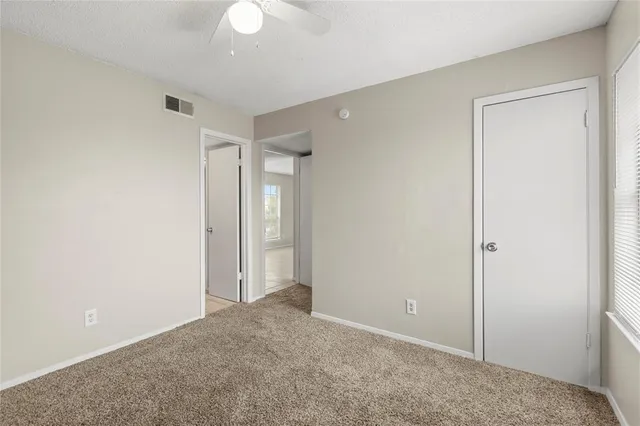 an empty room with closet area
