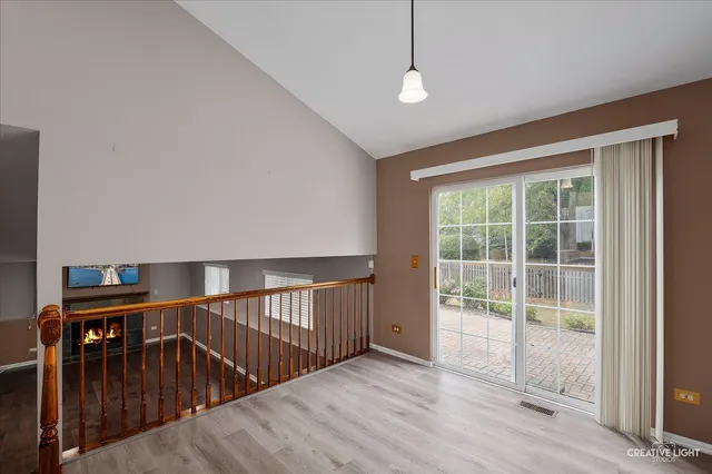 a view of hallway with wooden floor