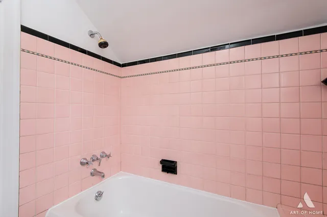 a bathroom with a bathtub and shower