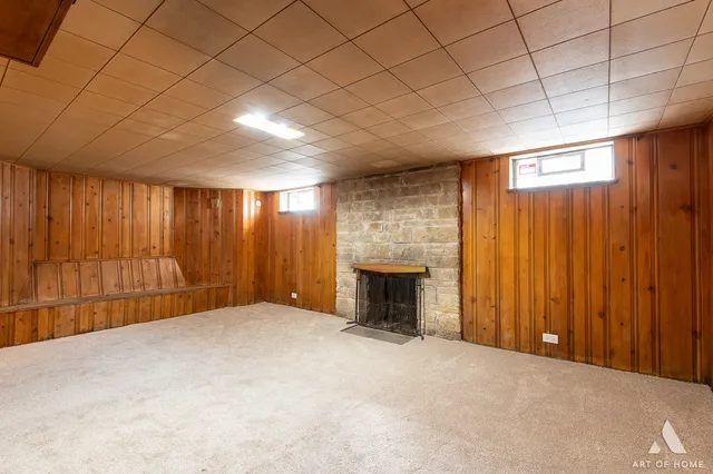 a view of an empty room with a fireplace