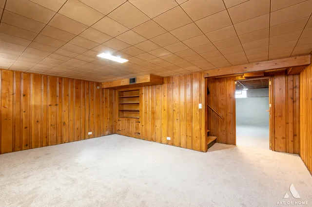 a view of an empty room with wooden walls