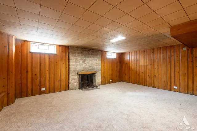 a view of an empty room with a fireplace