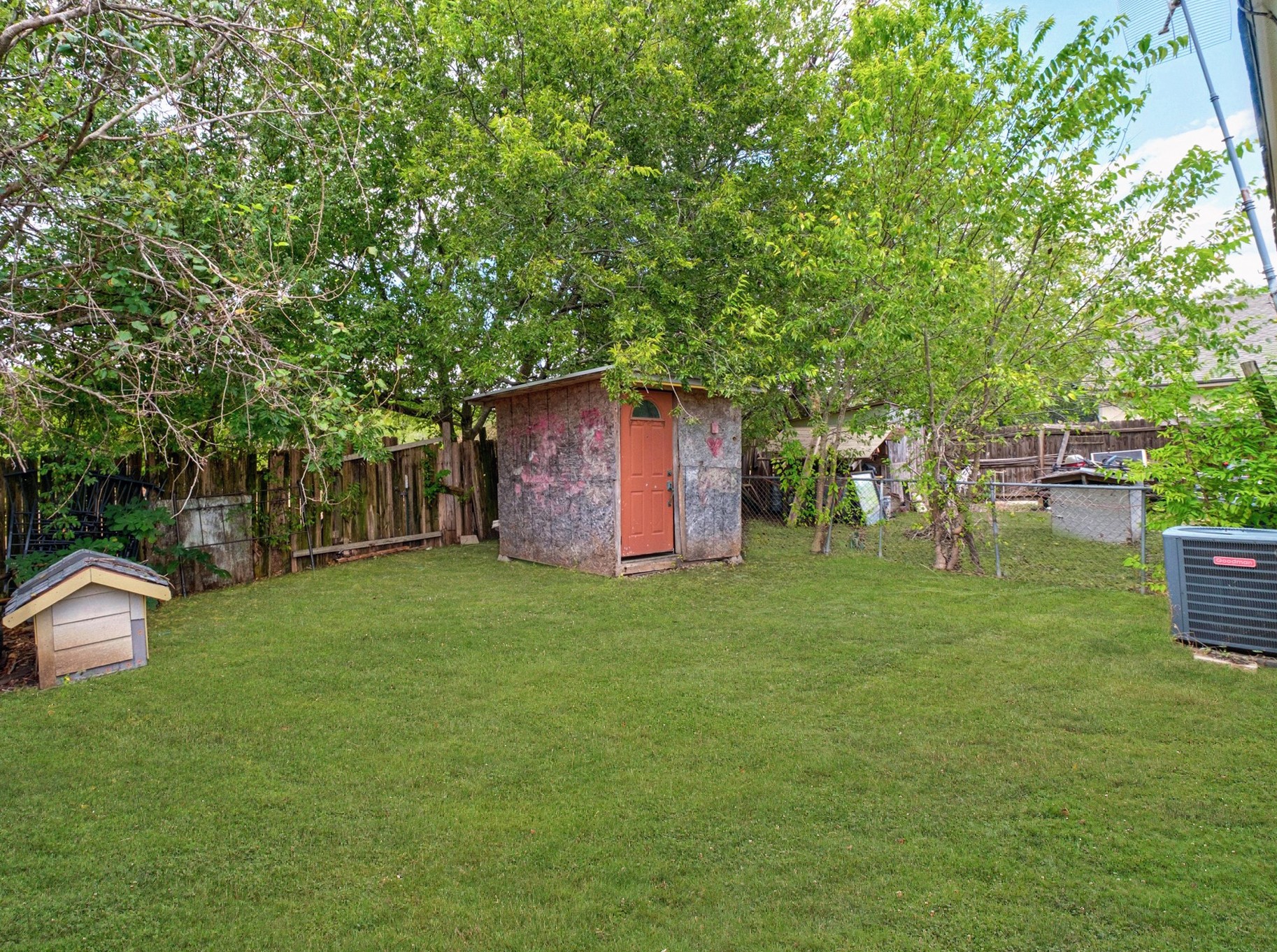 8203 Colony Loop Drive Austin, TX 78724 - Photo 11 of 11 a view of a backyard with table and chairs and a large tree