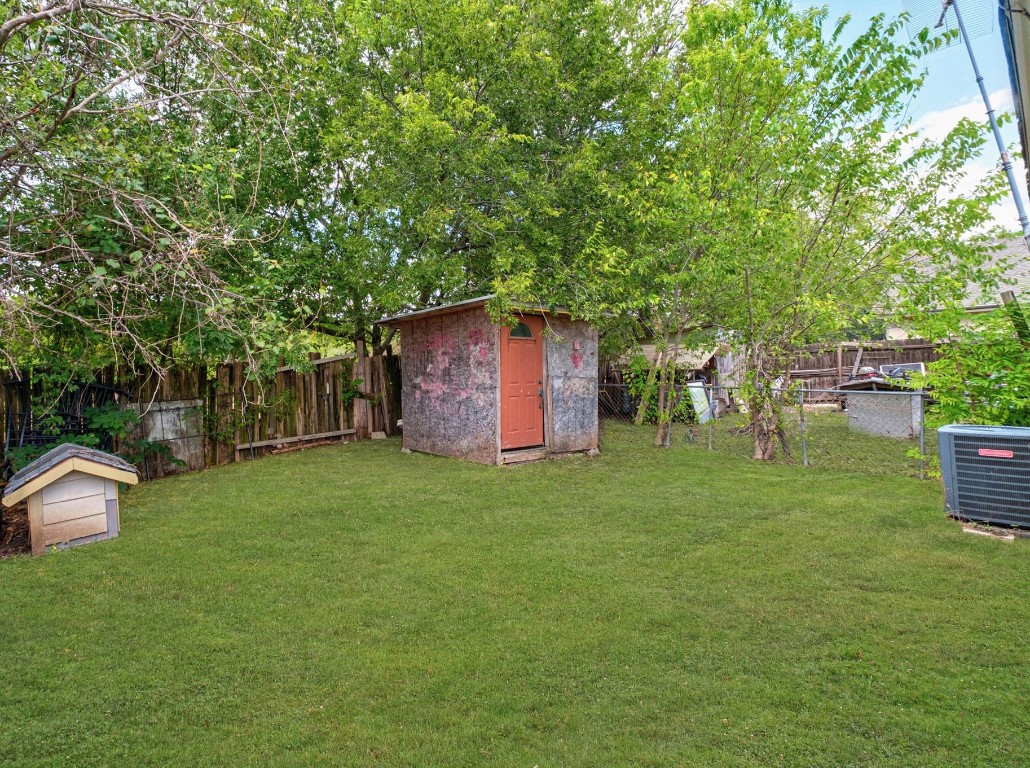 8203 Colony Loop Drive Austin, TX 78724 - Photo 11 of 11 a view of a backyard with table and chairs and a large tree