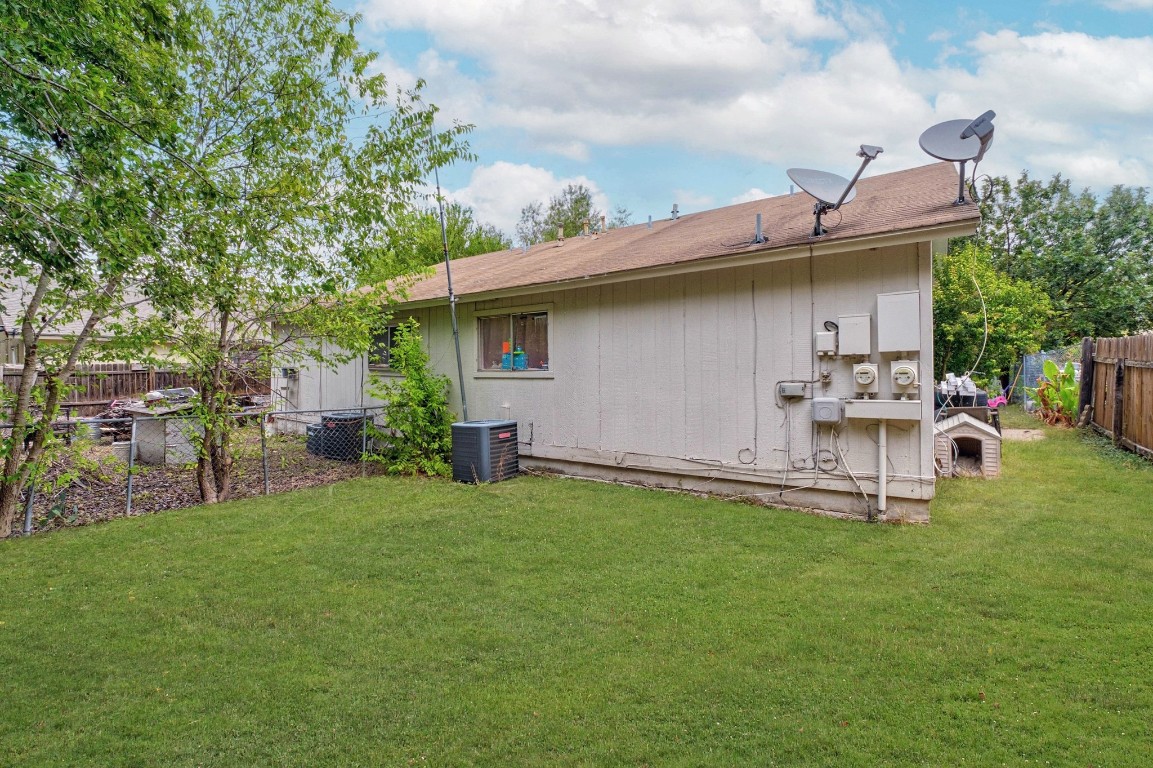 8203 Colony Loop Drive Austin, TX 78724 - Photo 10 of 11 a view of a backyard with table and chairs and potted plants