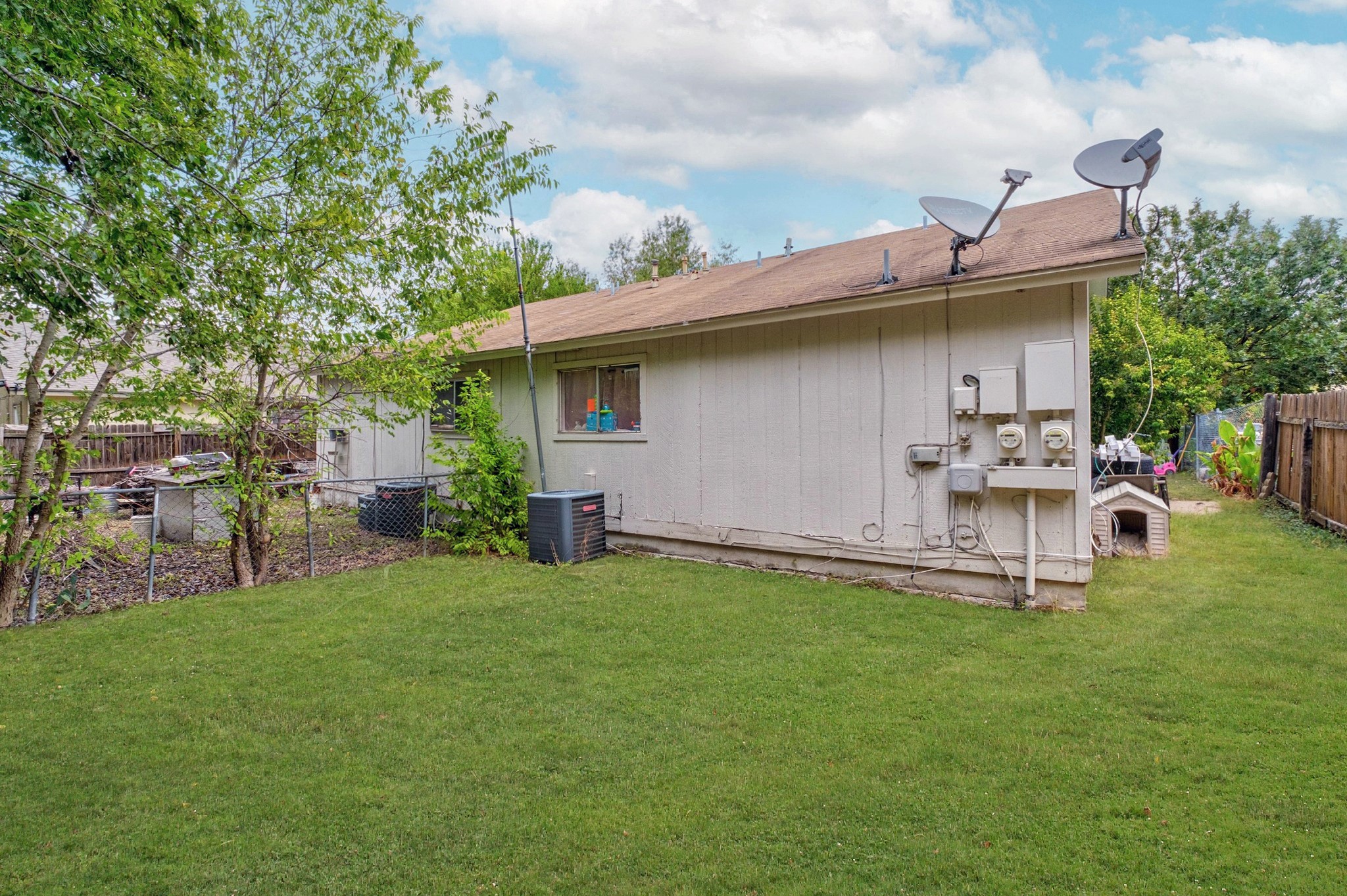 8203 Colony Loop Drive Austin, TX 78724 - Photo 10 of 11 a view of a backyard with table and chairs and potted plants