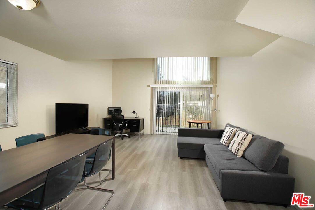 936 East Fairway Drive, Unit 23 Colton, CA 92324 - Photo 1 of 32 a living room with furniture and a flat screen tv