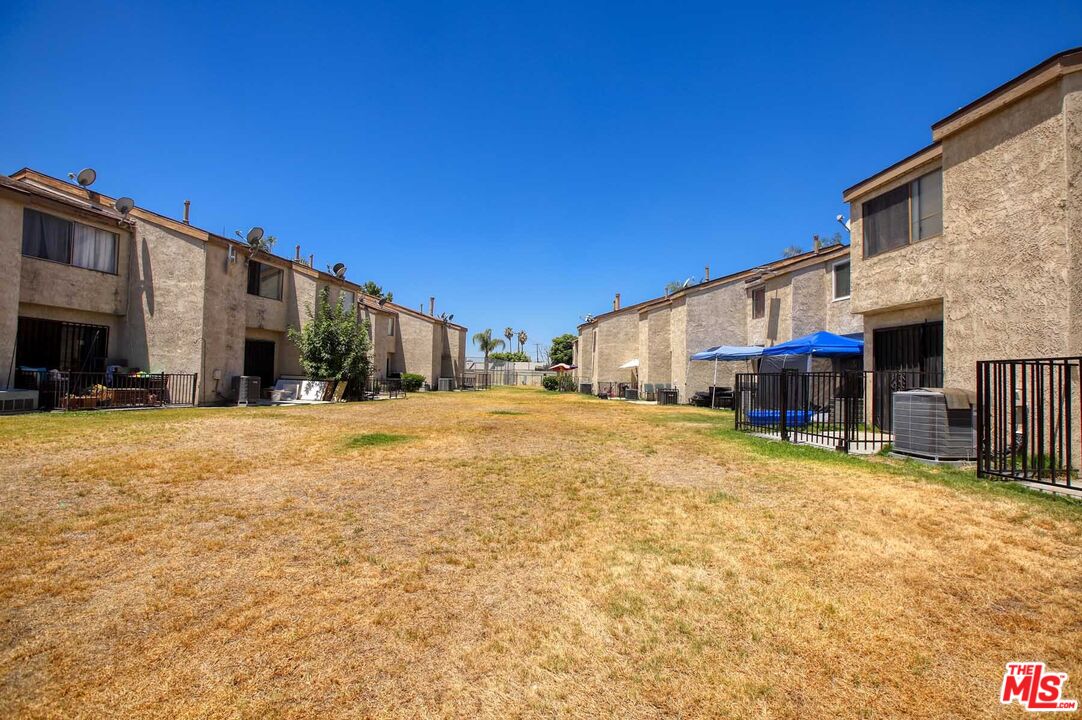 936 East Fairway Drive, Unit 23 Colton, CA 92324 - Photo 17 of 32 a view of a house with a yard