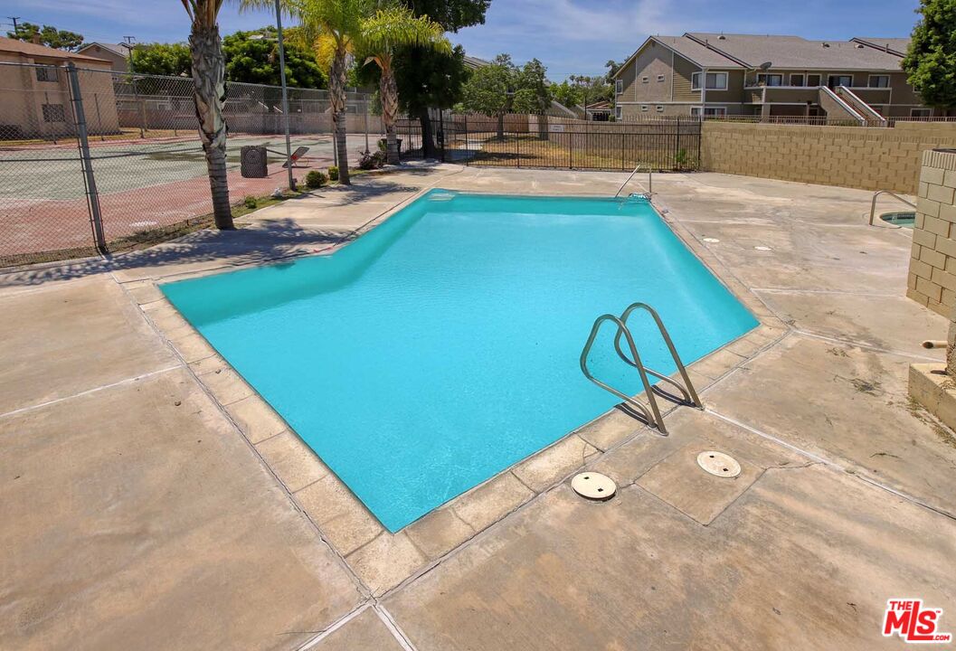 936 East Fairway Drive, Unit 23 Colton, CA 92324 - Photo 21 of 32 a view of a swimming pool with a patio
