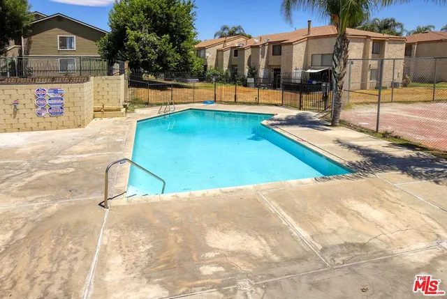 a view of a swimming pool with a patio