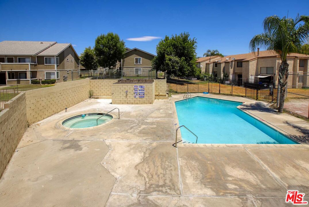 936 East Fairway Drive, Unit 23 Colton, CA 92324 - Photo 24 of 32 a view of a swimming pool with a patio