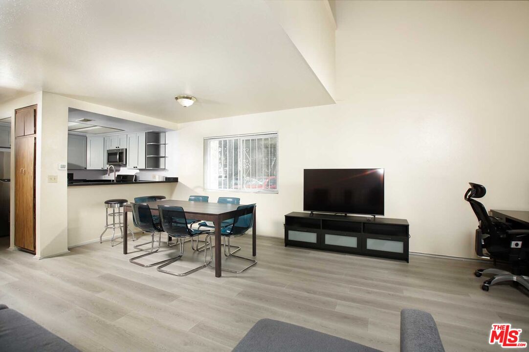 936 East Fairway Drive, Unit 23 Colton, CA 92324 - Photo 5 of 32 a living room with furniture and a flat screen tv