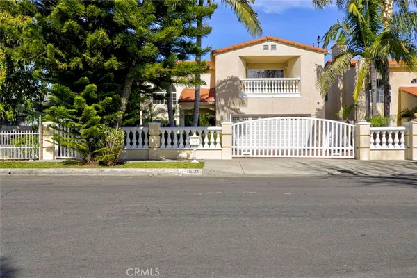 a view of a house with a swimming pool and a porch