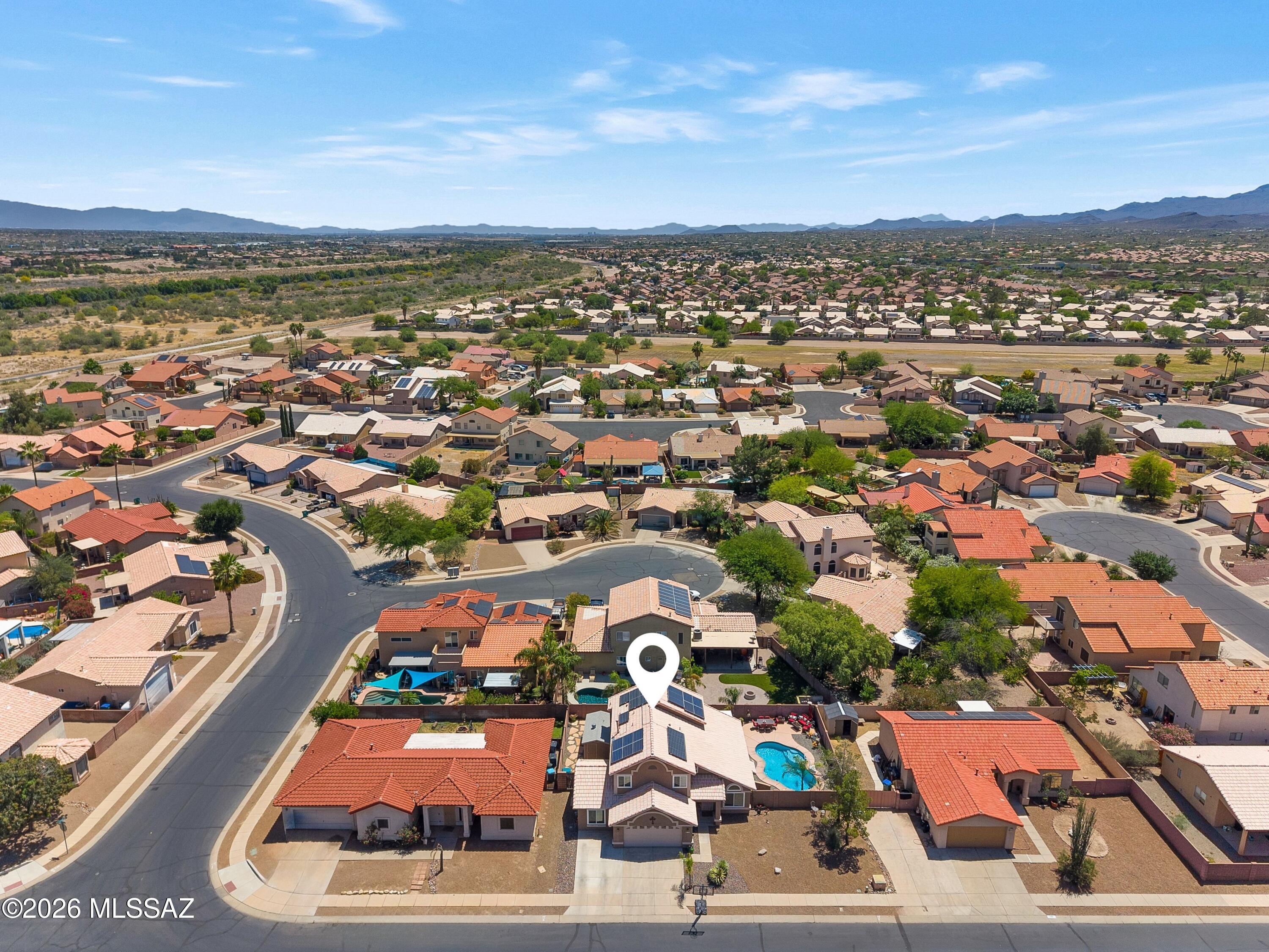 7159 West Maple Ridge Drive Tucson, AZ 85743 - Photo 30 of 42 an aerial view of residential houses with outdoor space