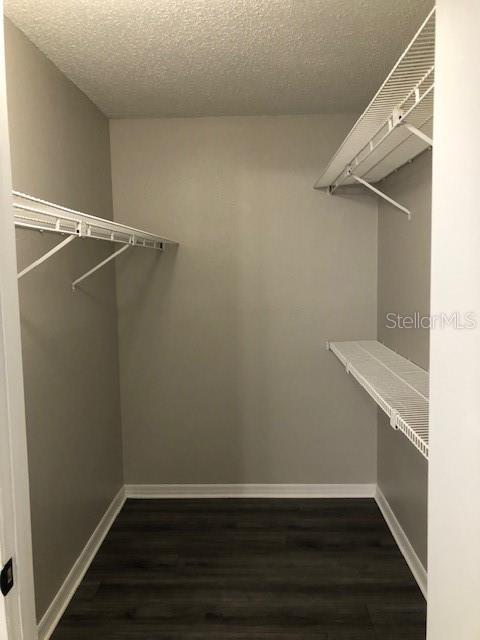 957 Salt Pond Place, Unit 101 Altamonte Springs, FL 32714 - Photo 14 of 20 a view of a room with wooden floor and white walls