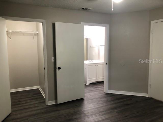 957 Salt Pond Place, Unit 101 Altamonte Springs, FL 32714 - Photo 15 of 20 an empty room with wooden floor and window