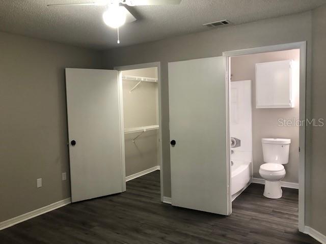 957 Salt Pond Place, Unit 101 Altamonte Springs, FL 32714 - Photo 16 of 20 a bathroom with a toilet a sink and a mirror