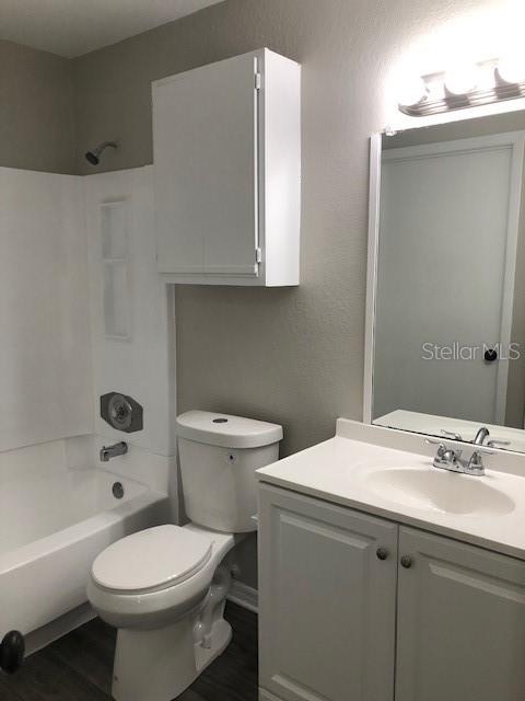957 Salt Pond Place, Unit 101 Altamonte Springs, FL 32714 - Photo 17 of 20 a bathroom with a sink a toilet and shower