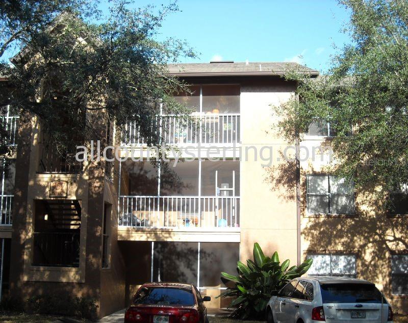 957 Salt Pond Place, Unit 101 Altamonte Springs, FL 32714 - Photo 2 of 20 a front view of a house with a yard