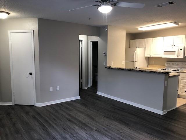 957 Salt Pond Place, Unit 101 Altamonte Springs, FL 32714 - Photo 4 of 20 a view of a kitchen with a sink and a window