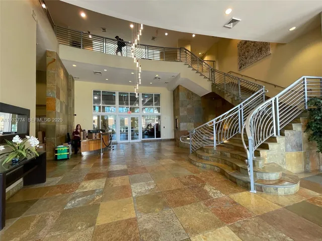 a view of a backyard with plants and outdoor seating