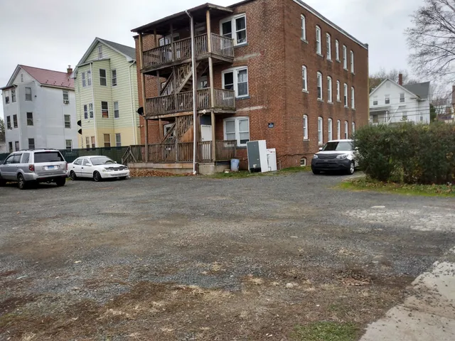 a view of cars parked in front of a building