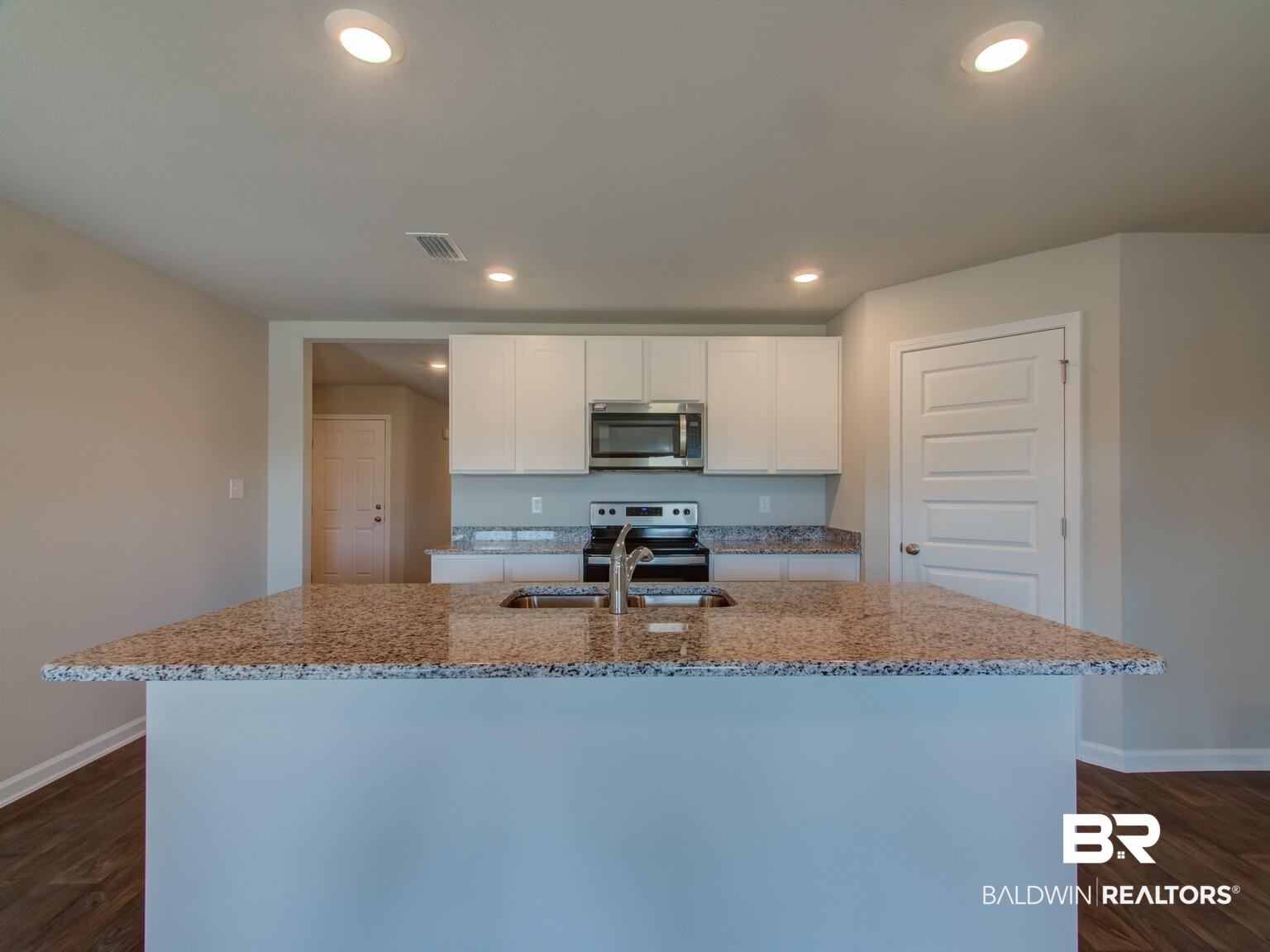 23953 Citation Loop Daphne, AL 36526 - Photo 12 of 49 Kitchen featuring light stone countertops, dark wood-style floors, white cabinets, stainless steel appliances, and recessed lighting