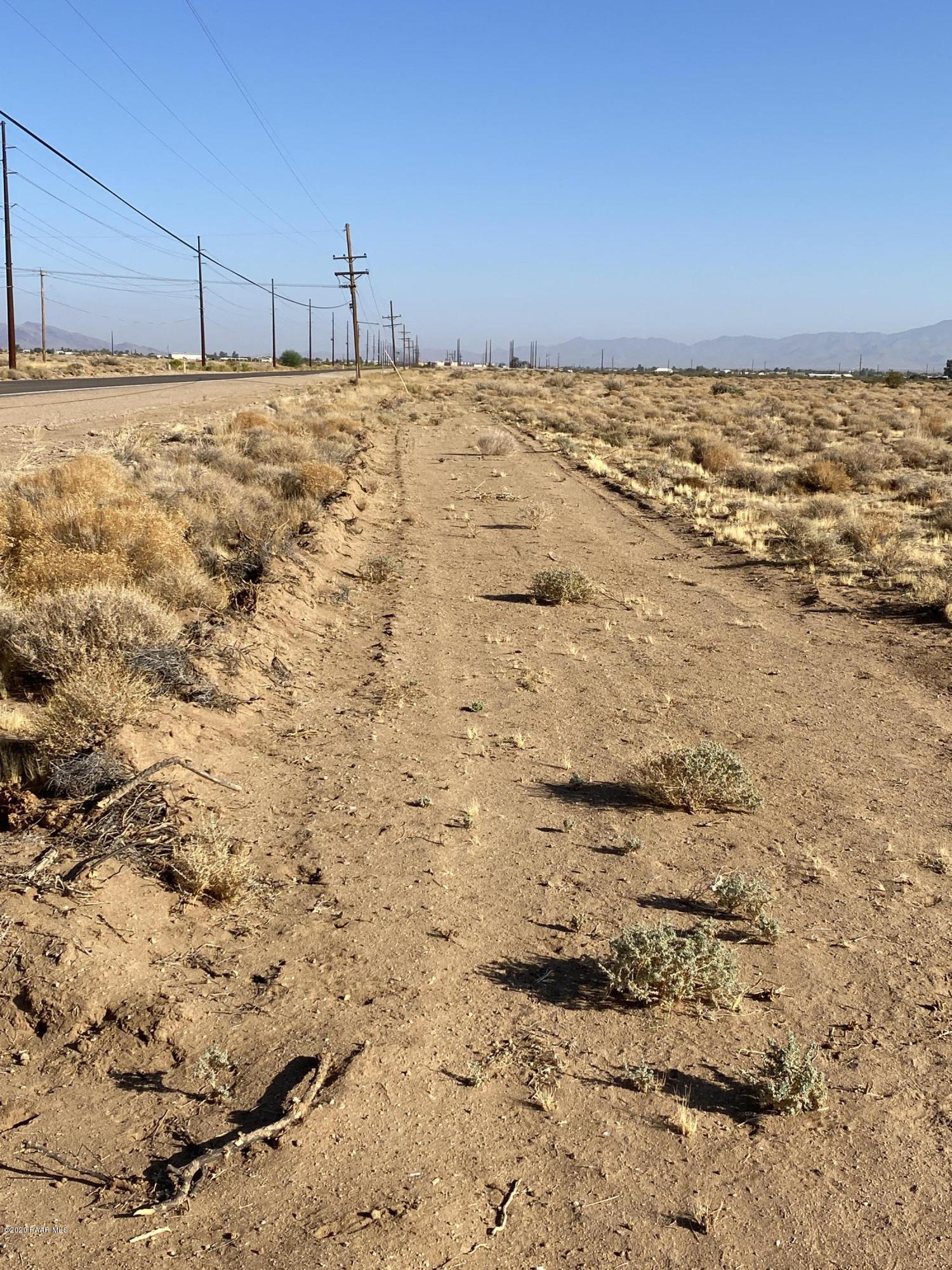 1584 Colorado Road Golden Valley, AZ 86413 - Photo 13 of 26 13-Cleared perimeter road on west side l