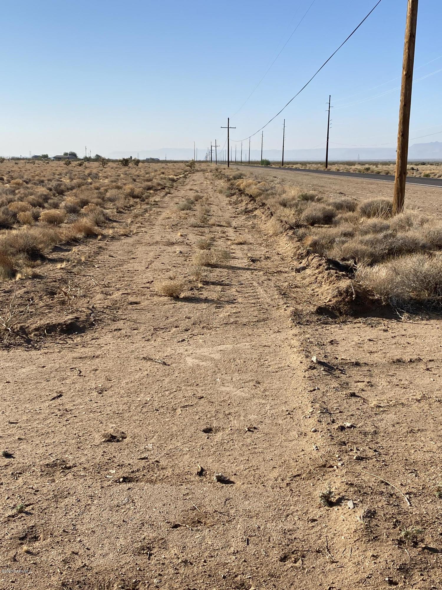 1584 Colorado Road Golden Valley, AZ 86413 - Photo 14 of 26 14-Cleared perimeter rd on west side loo