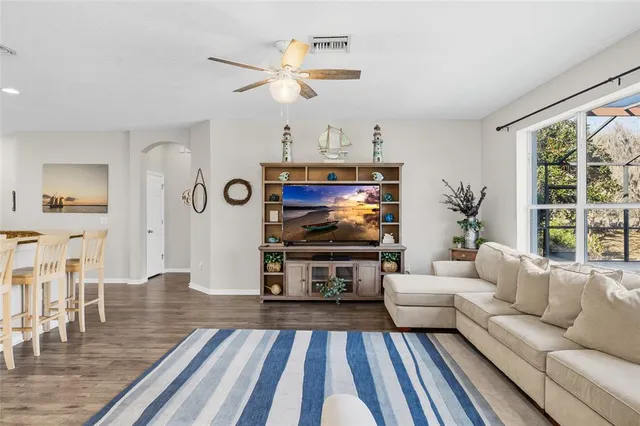 a kitchen with stainless steel appliances granite countertop a stove refrigerator and a sink