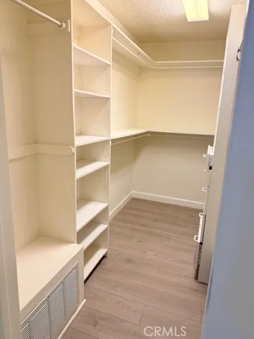 a bathroom with a shower a toilet and a sink