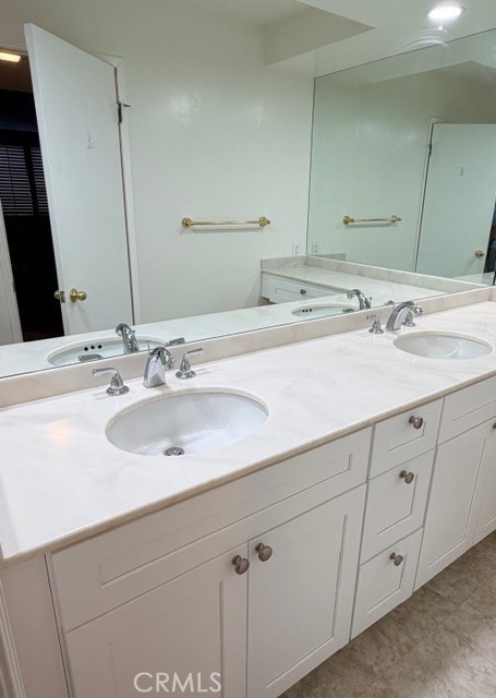 14106 Dickens Street, Unit 101 Sherman Oaks, CA 91423 - Photo 18 of 26 a bathroom with a sink and a mirror