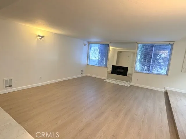a view of kitchen cabinets and refrigerator