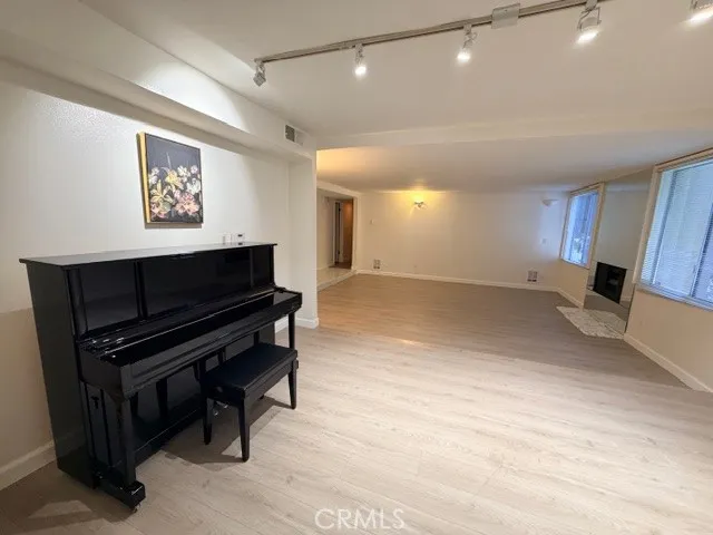 a kitchen with a sink a stove and a microwave