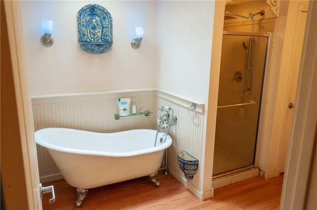 a bathroom with a tub and shower