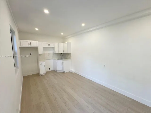 a view of a kitchen with a sink