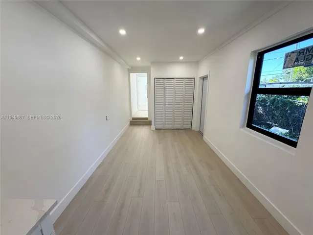 a view of hallway with a large window
