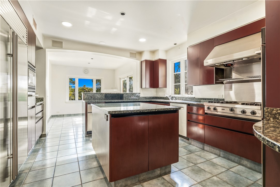 2350 Quay Dock Road Vero Beach, FL 32967 - Photo 19 of 35 a kitchen with stainless steel appliances granite countertop a stove a sink and a refrigerator
