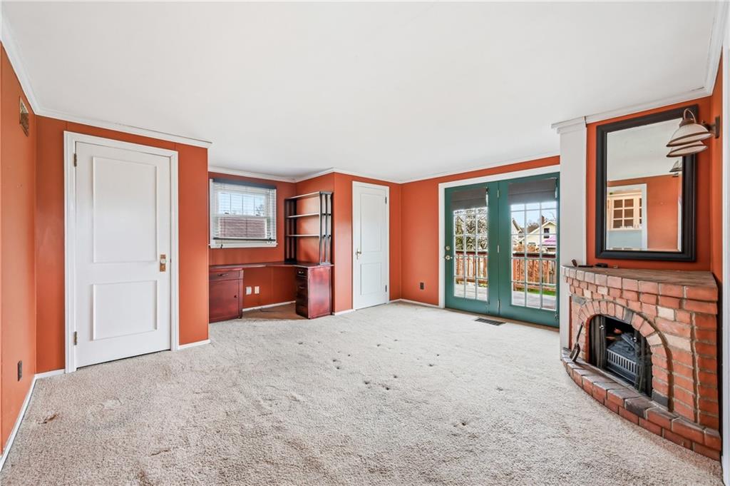 1027 Myrtle Place Sharon, PA 16146 - Photo 11 of 19 a big room with windows and fireplace